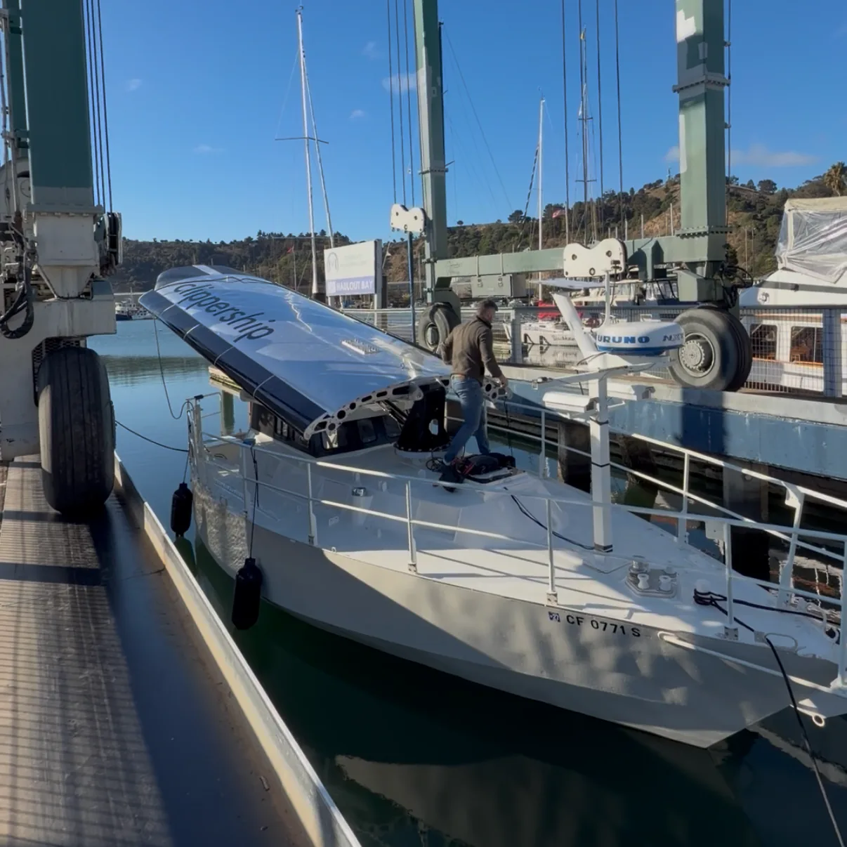 Vessel on a travel-lift at a marina dock