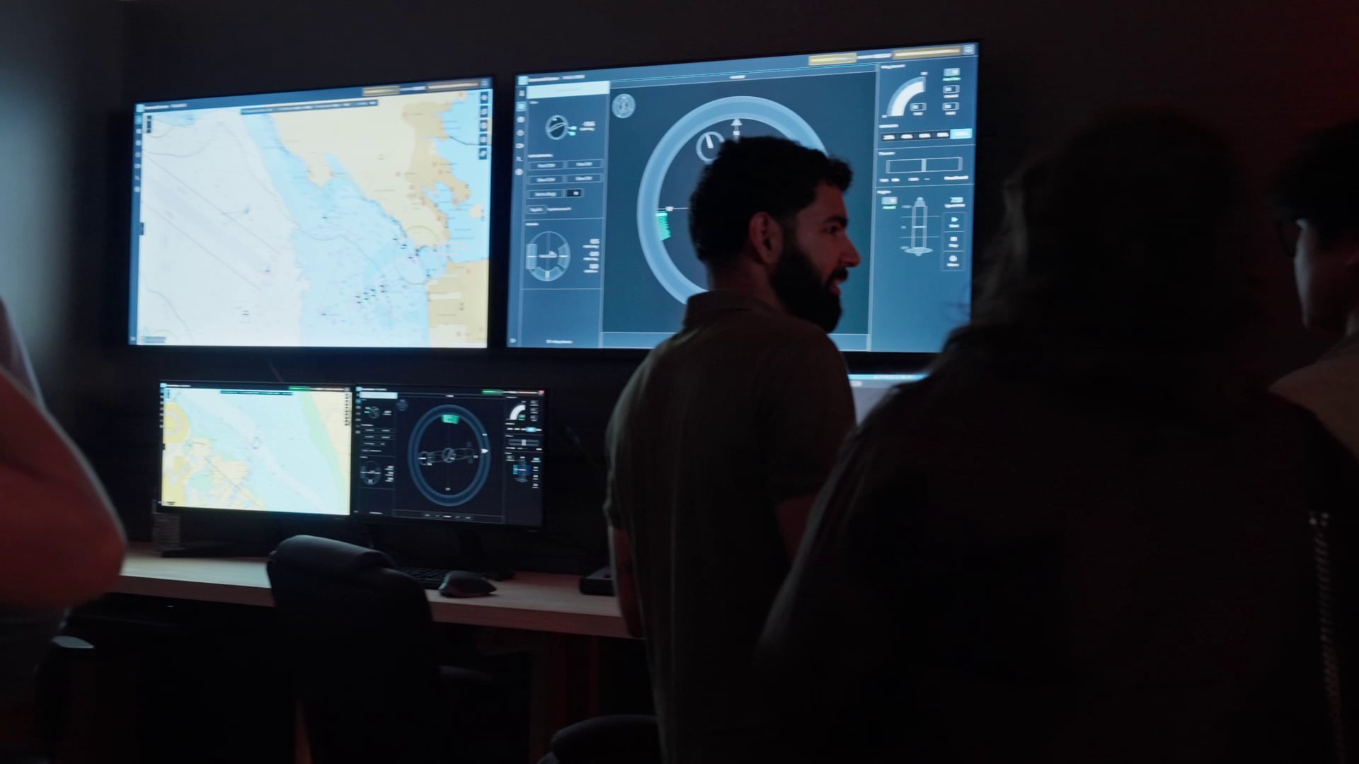 Visitors in front of navigation and vessel-monitoring screens
