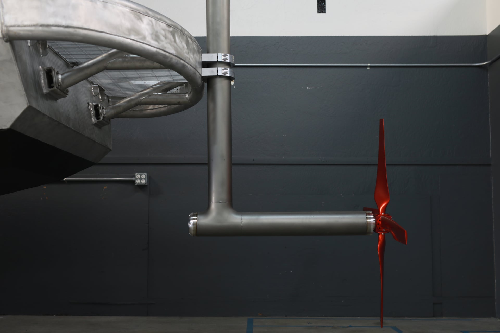 Red turbine blades on the node’s suspended turbine assembly